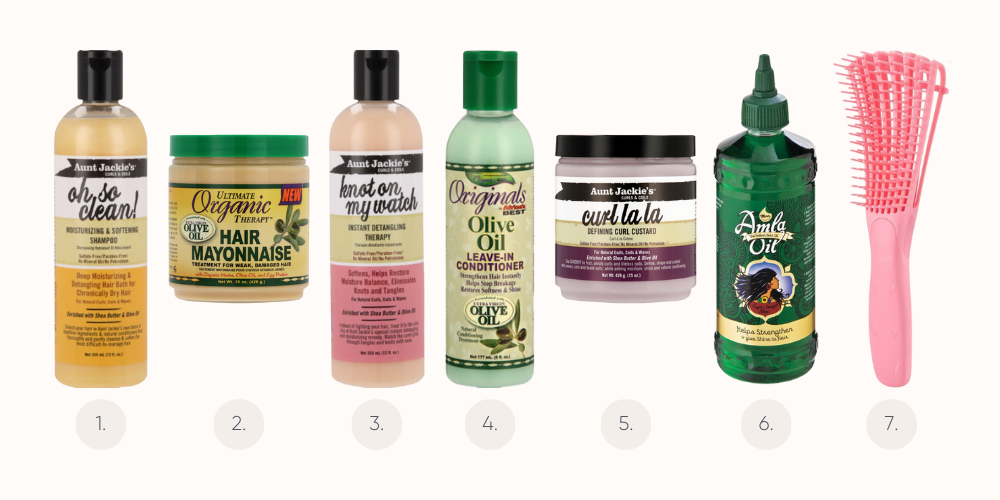 Bottles of various natural hair products with ingredients like aloe and coconut